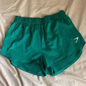 green gymshark shorts